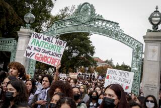 Hundreds of people, mostly students, gather to call for a cease-fire in Gaza and read the names of Palestinians killed, during a protest on the UC Berkeley campus in Berkeley, Calif. on Thursday, Nov. 16, 2023. (Brontë Wittpenn/San Francisco Chronicle via AP)
