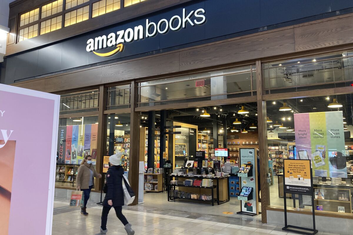 People walk by an Amazon Books store