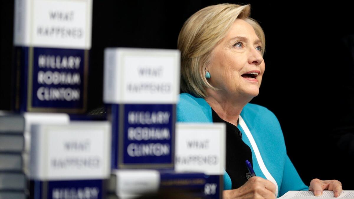 Hillary Rodham Clinton signs copies of her book "What Happened" at a bookstore in New York on Sept. 12, 2017.