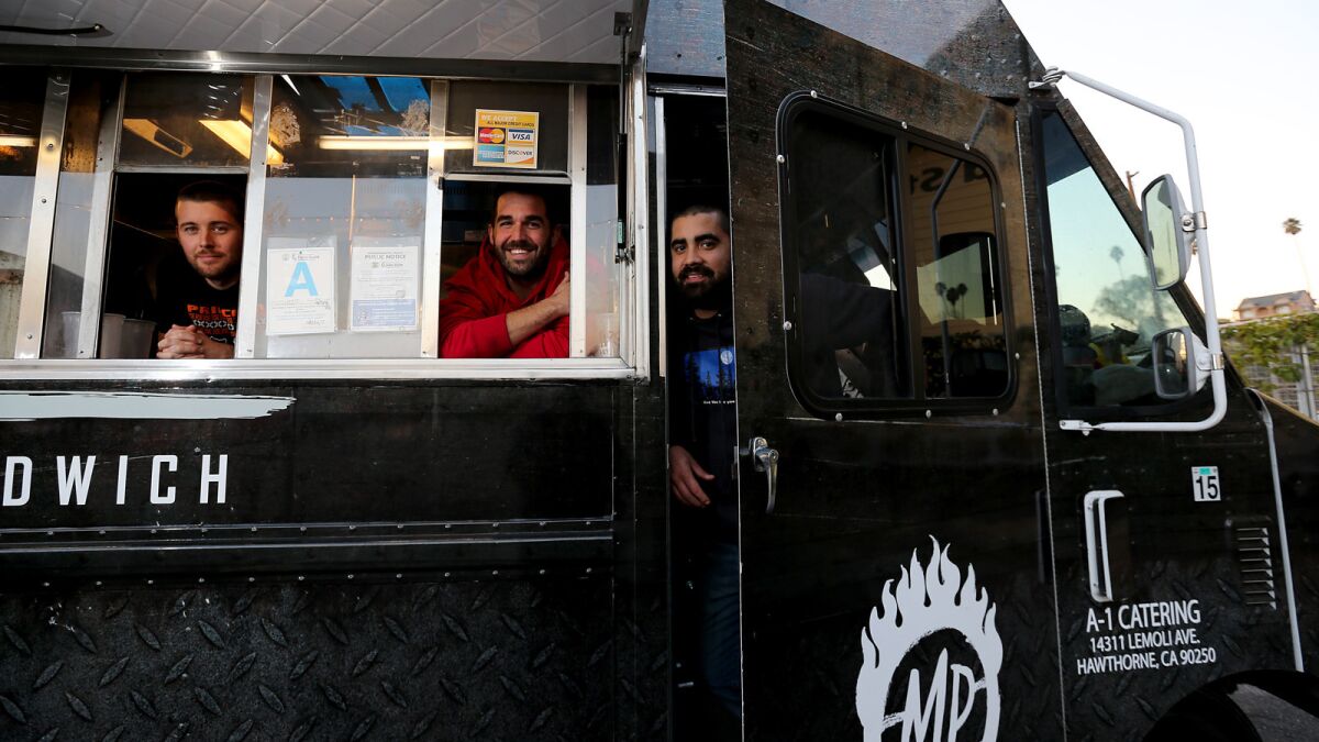 Macks Collins, left, Joseph Drewer and Bryan Kidwell are the principals of Mad Pambazos food truck, which specializes in pambazo sandwiches.
