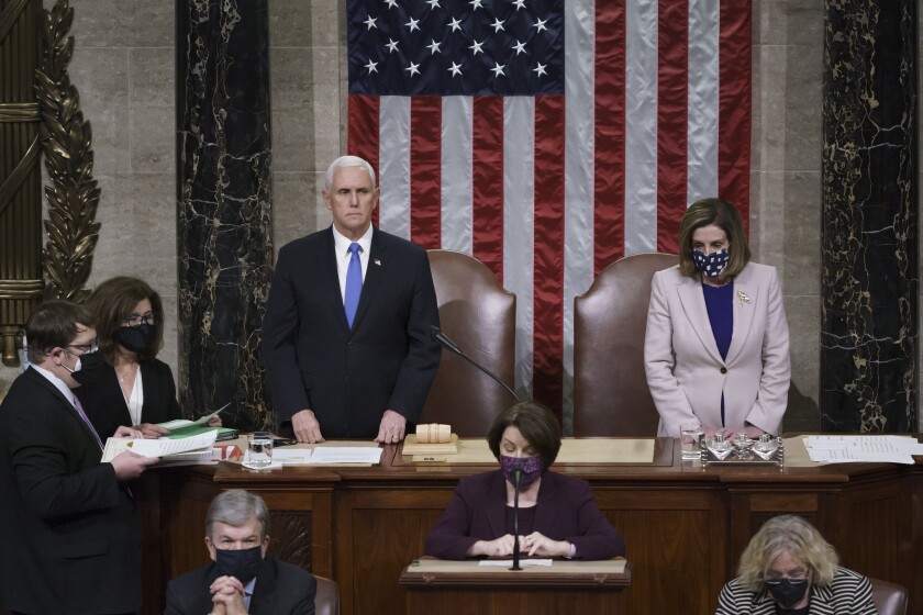 Vice President Mike Pence and Speaker of the House Nancy Pelosi read the final certification of Electoral College votes.