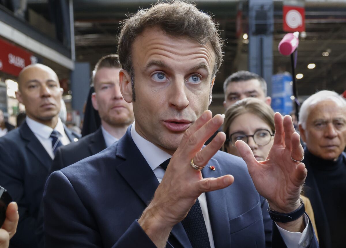 French President Emmanuel Macron speaks to the media as he visits the International Agriculture Fair in Paris, Saturday, Feb. 25, 2023. (Ludovic Marin, Pool via AP)