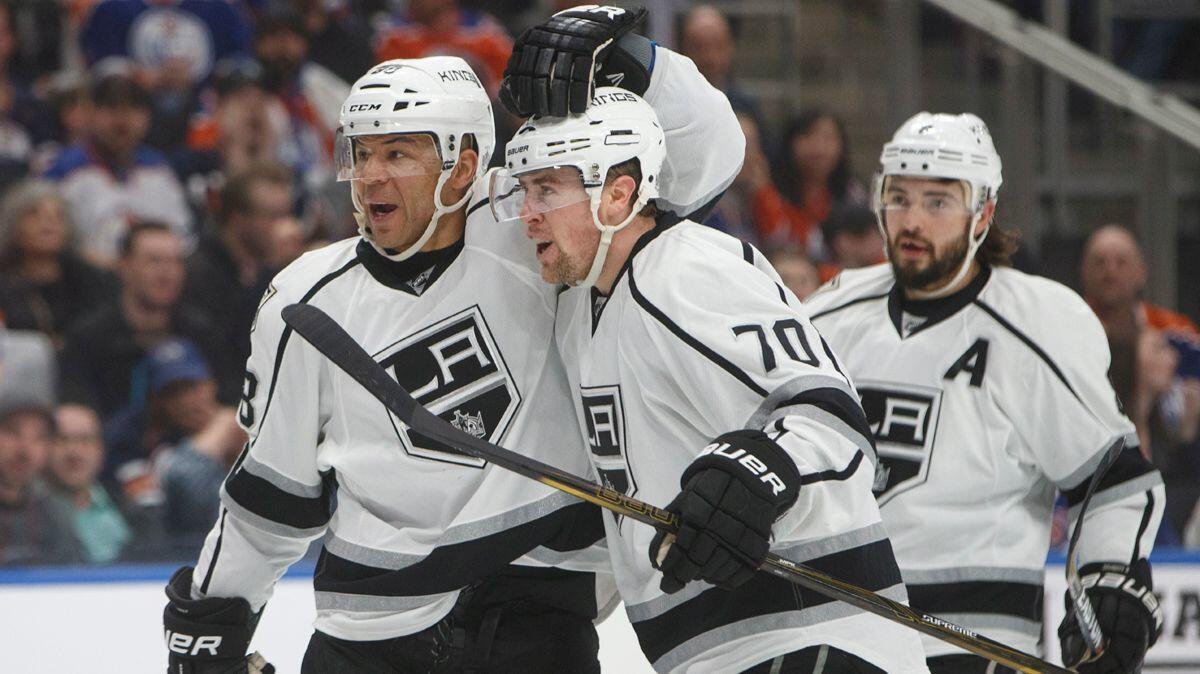 Kings' Jarome Iginla (88) Tanner Pearson (70) and Drew Doughty (8) celebrate a goal during the first period against the Oilers on Monday.