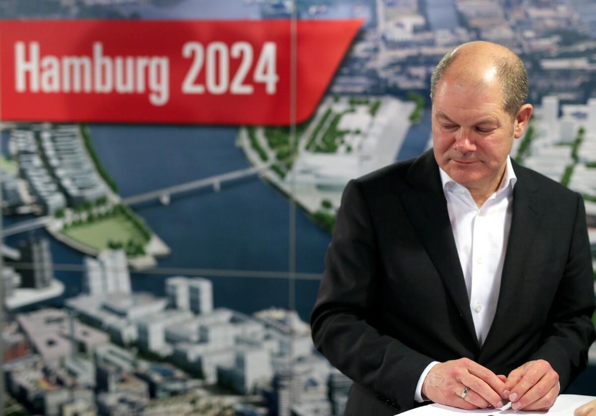 Hamburg First Mayor Olaf Scholz reacts after the referendum on Hamburg's Olympic bid is rejected.