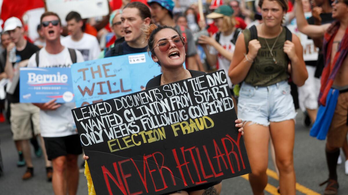 Supporters of Sen. Bernie Sanders protest in Philadelphia on Monday, July 25. On Sunday, Debbie Wasserman Schultz announced she would step down as DNC chairwoman at the end of the party's convention, after emails presumably stolen by hackers were publicly posted on the Internet.