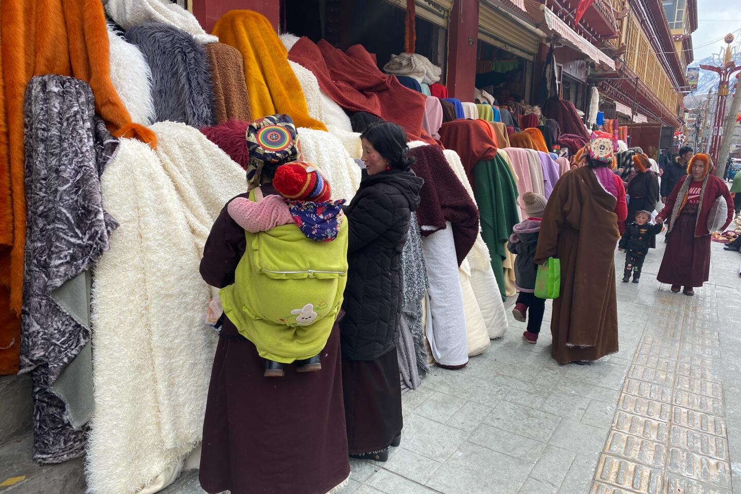 Tibetan women shop in Garze city on Jan. 19, 2020.
