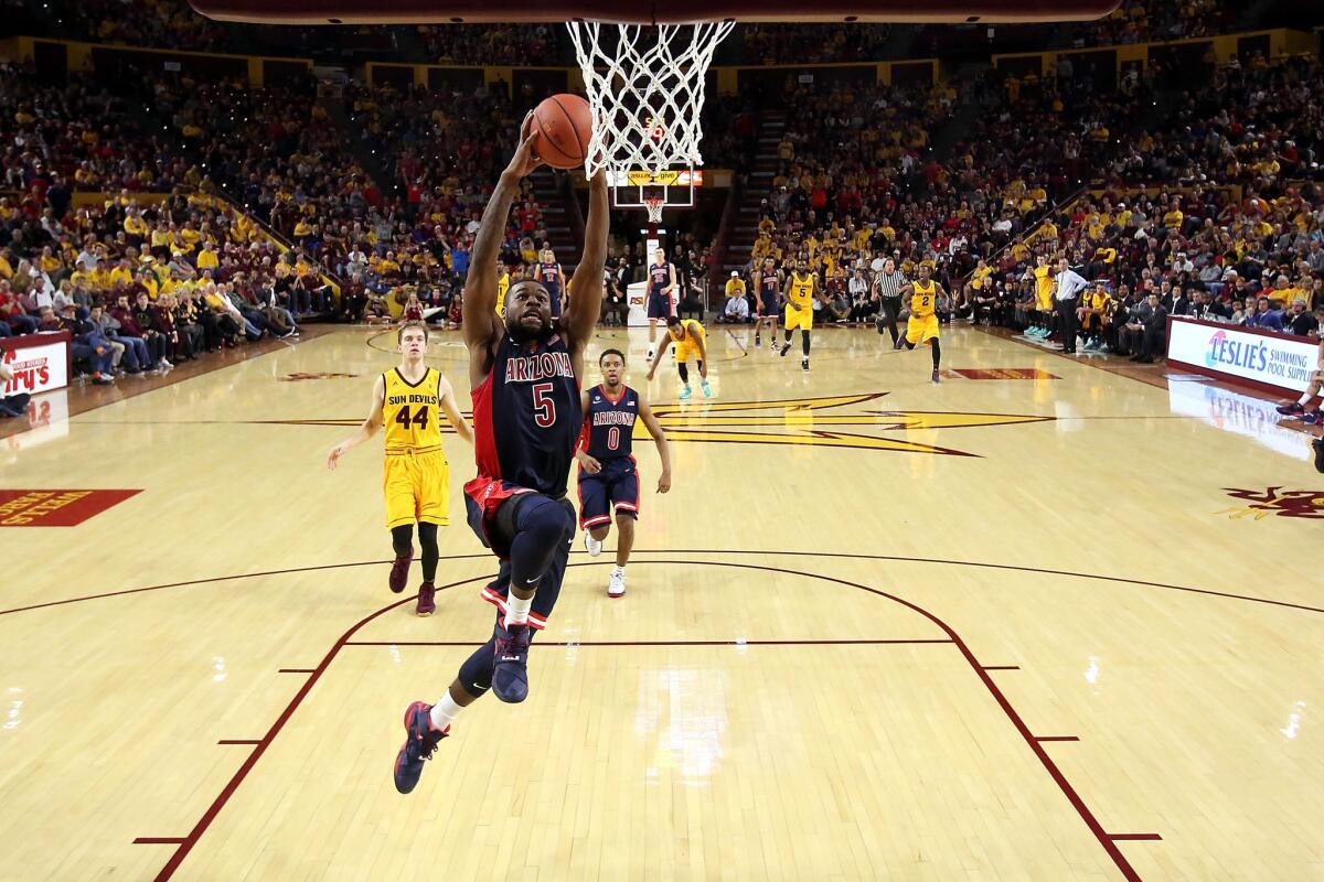 Arizona guard Kadeem Allen dunks during the second half of a game against Arizona State.