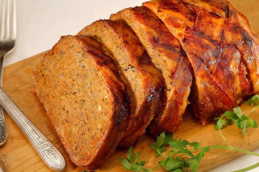 Layer your meatloaf with strips of bacon in this bacon-wrapped meatloaf.