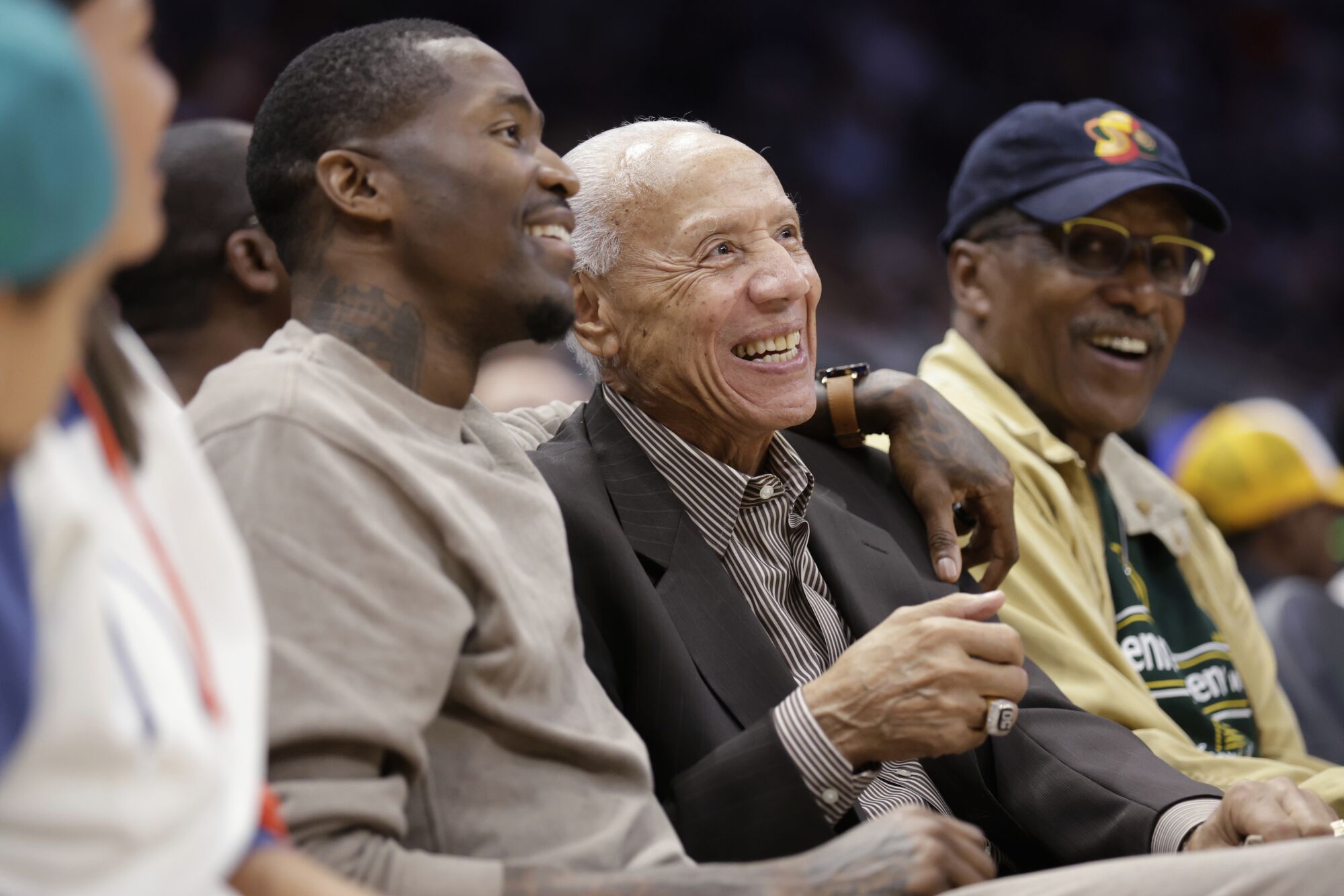 Former NBA player Jamal Crawford, left, with his arm around former player and coach Lenny Wilkens.