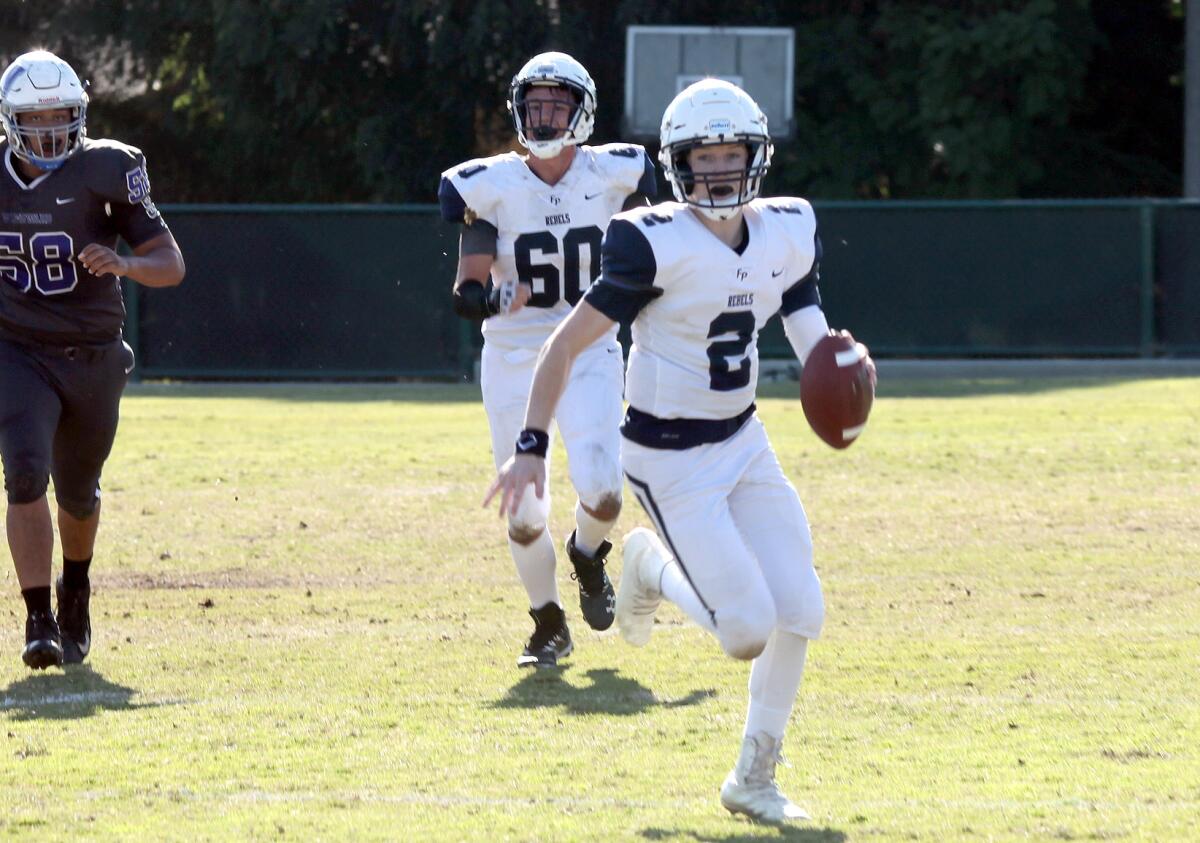 Flintridge Prep's quarterback Max Gitlin (2) runs with the ball making some yardage during Flintridge Prep football team competing against Windward School in the CIF Southern Section Division 1 eight-man semifinal football game at the Windward School football field in Los Angeles, Ca., Saturday, November 23, 2019. (photo by James Carbone)