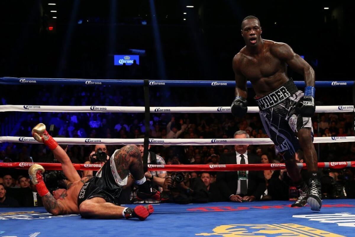 Deontay Wilder knocks out Artur Szpilka in the ninth round of their WBC heavyweight title bout on Jan. 16.