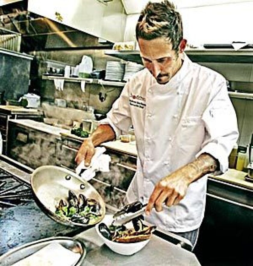 Chef de cuisine Andrew Kirshner, here in the kitchen at Wilshire, was promoted to executive chef in February. Kirshner has pulled back the menu, stripping away anything fussy and going for straightforward California cuisine with a broader appeal.