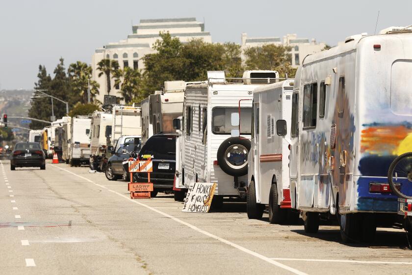 LOS ANGELES, CA - JUNE 11: Campers are parked along West Jefferson Blvd as Scott Culbertson, executive director of Friends of the Ballona Wetlands gives a tour of some of the destruction caused by homeless encampments that are encroaching on the Freshwater Marsh in Ballona Wetlands. Play Del Rey on Friday, June 11, 2021 in Los Angeles, CA. (Al Seib / Los Angeles Times).