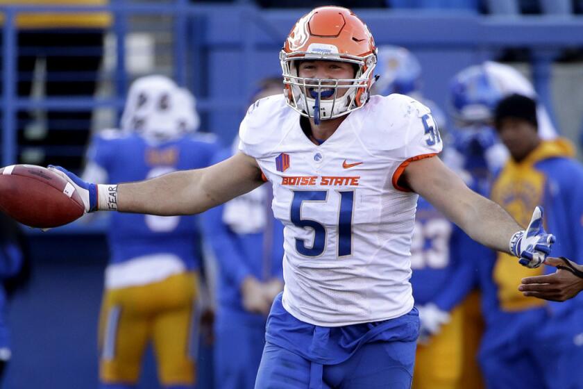 Boise State linebacker Ben Weaver celebrates after intercepting a pass during the second half of against San Jose State on Nov. 27.