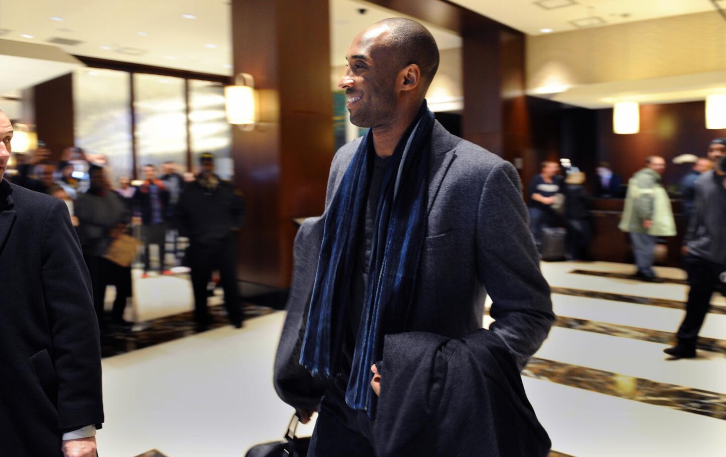 Lakers star Kobe Bryant walks through the Westin Hotel lobby beforea game against the Grizzlies in Memphis, Tenn., on Feb. 24, 2016.