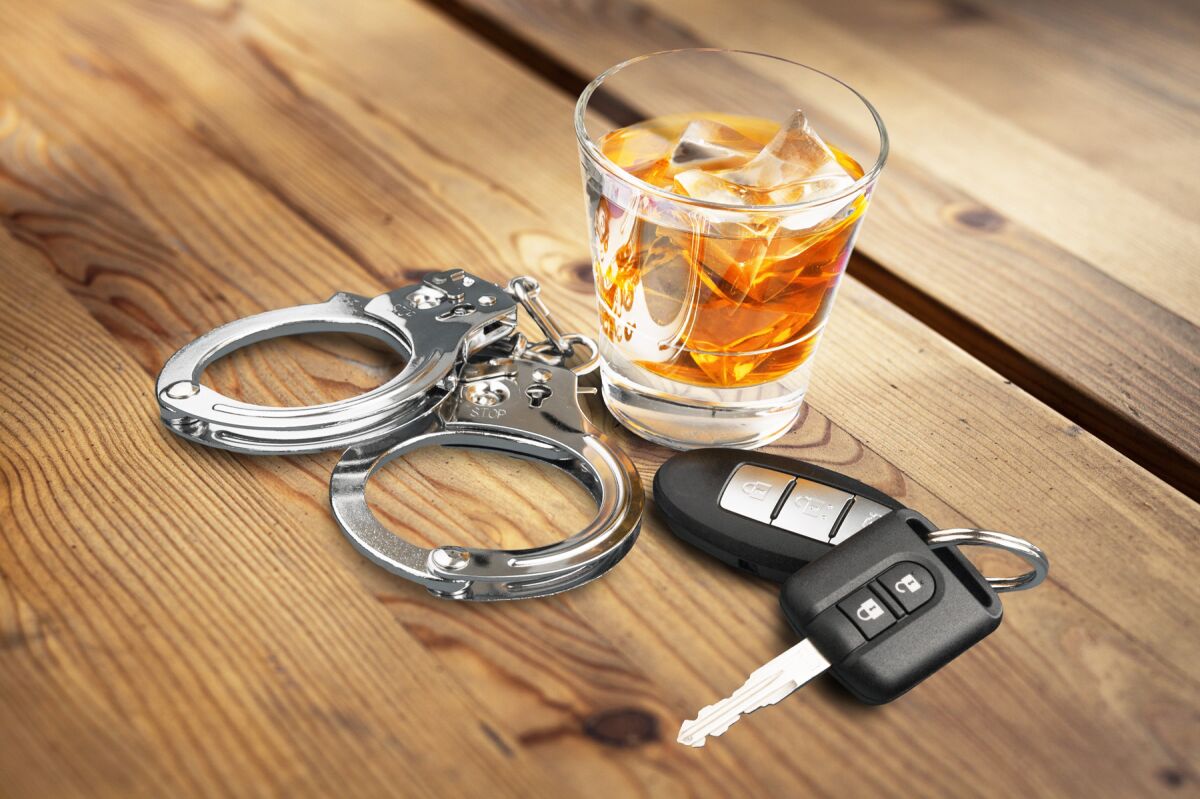 alcohol, car keys, handcuffs