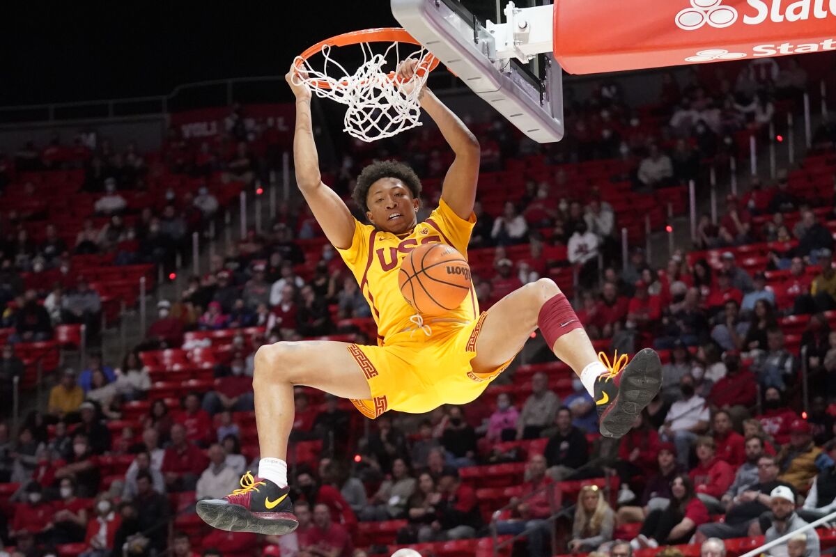 USC guard Boogie Ellis dunks against Utah in the first half Saturday.