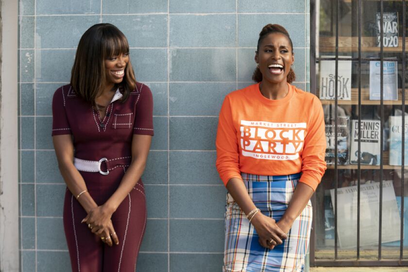 "Insecure" stars Yvonne Orji, left, and Issa Rae out and about in the city we love.