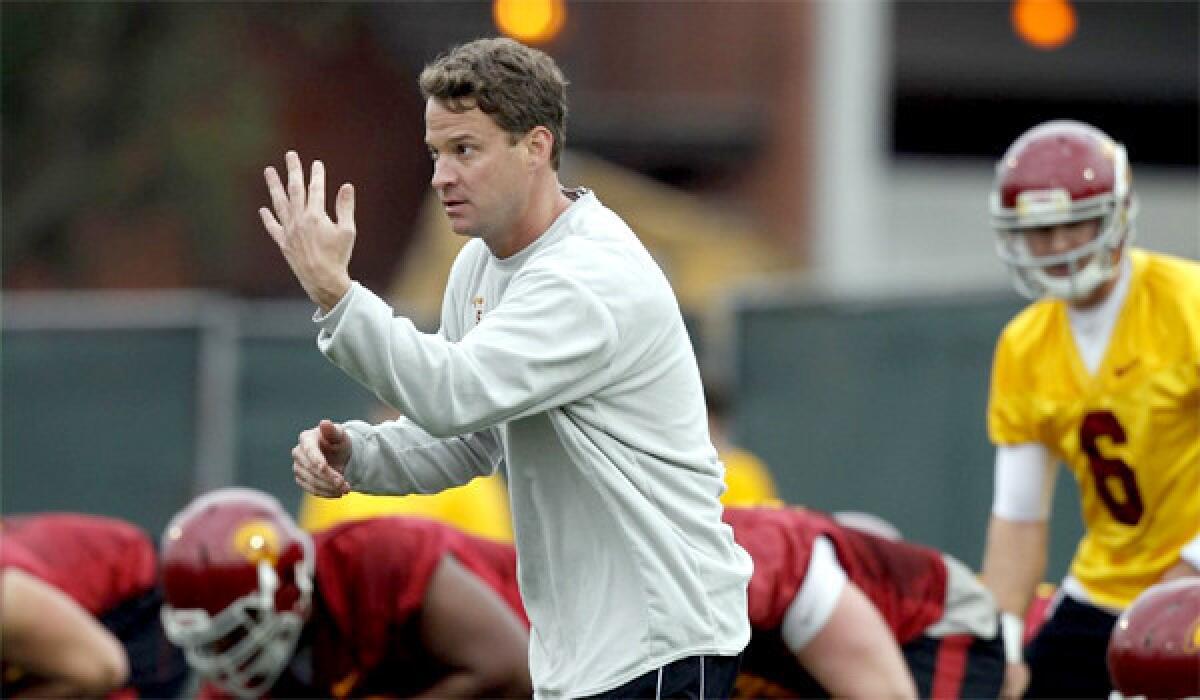 Lane Kiffin has become more involved with a greater number of players and given up some of the play-calling duties, following a disappointing 7-6 season for USC last year.