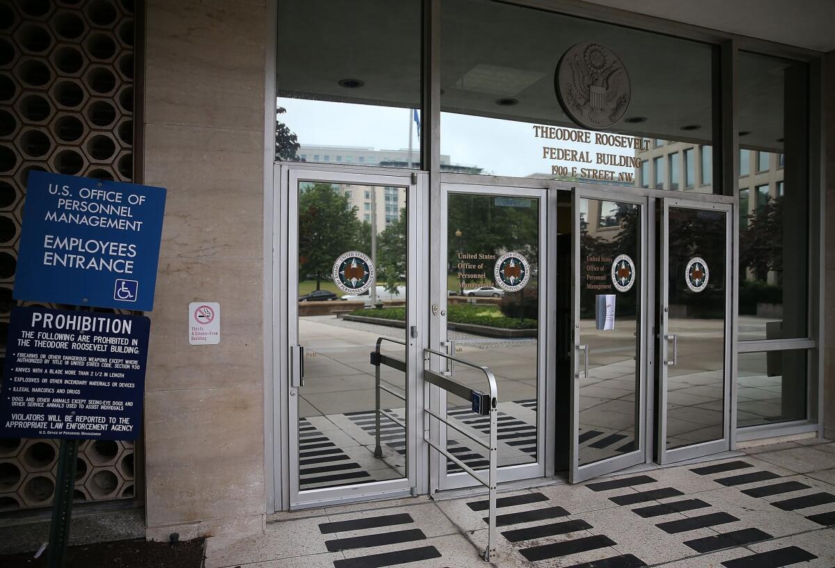 The entrance to the building that houses the Office of Personnel Management headquarters in Washington on June 5. U.S. investigators have said that at least 4 million current and former federal employees might have had their personal information stolen by Chinese hackers.