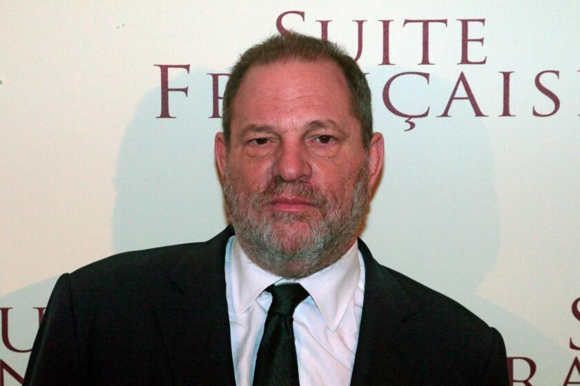 (FILES) This file photo taken on March 10, 2015 shows US producer Harvey Weinstein posing before the world preview screening of the film he produced, "French suite" (Suite francaise) of British director Saul Dibb, in a Paris movie hall. New York police said on October 12, 2017 they have reopened a investigation into allegations of a 2004 sexual assault by disgraced movie mogul Harvey Weinstein. An avalanche of claims of sexual harassment, assault and rape by the Hollywood heavyweight have surfaced since the publication last week of an explosive New York Times report alleging a history of abusive behavior dating back decades. / AFP PHOTO / JACQUES DEMARTHONJACQUES DEMARTHON/AFP/Getty Images ** OUTS - ELSENT, FPG, CM - OUTS * NM, PH, VA if sourced by CT, LA or MoD **