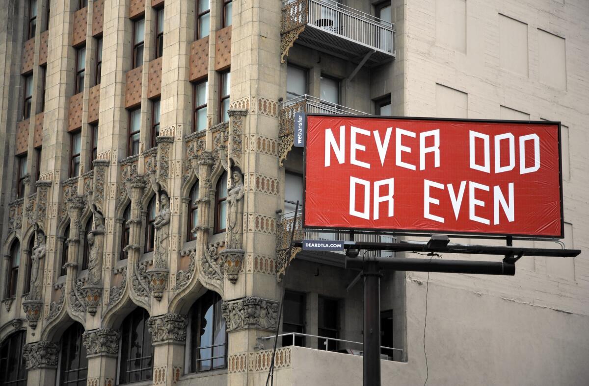 This billboard adjacent to the Ace Hotel in downtown Los Angeles now has a piece of art by Brian Roettinger. Other artists' works will follow.