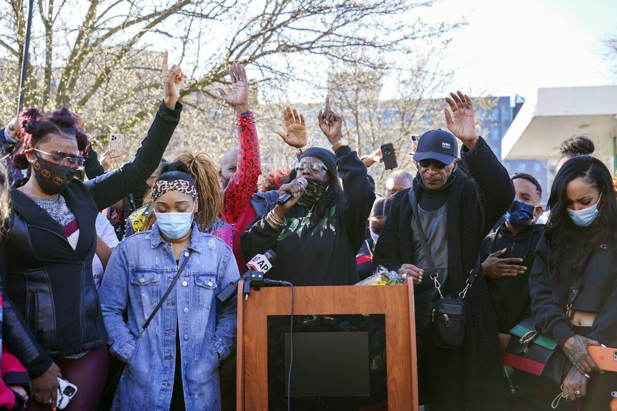 DMX'S ex-wife, Tashera Simmons, left, and his fiancé Desiree Lindstrom, second from left, are joined by family and friends