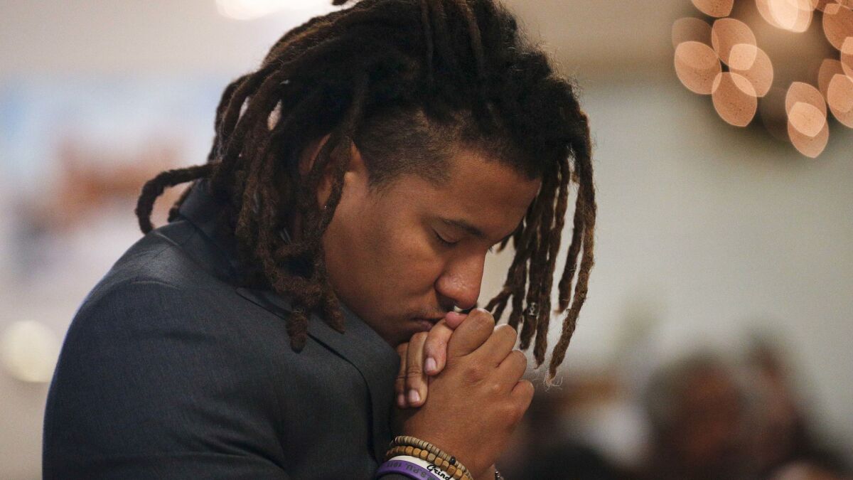 Jeremiah Chapman prays during a 16th Street Baptist Church service Sunday in Birmingham, Ala.