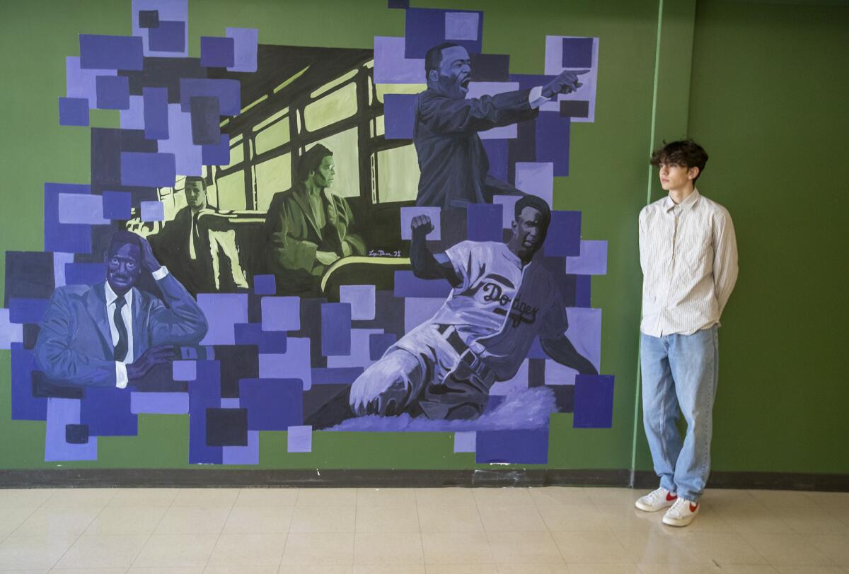 Logan Dunn, a recent graduate from Edison High School, painted a civil rights mural in the social studies building.