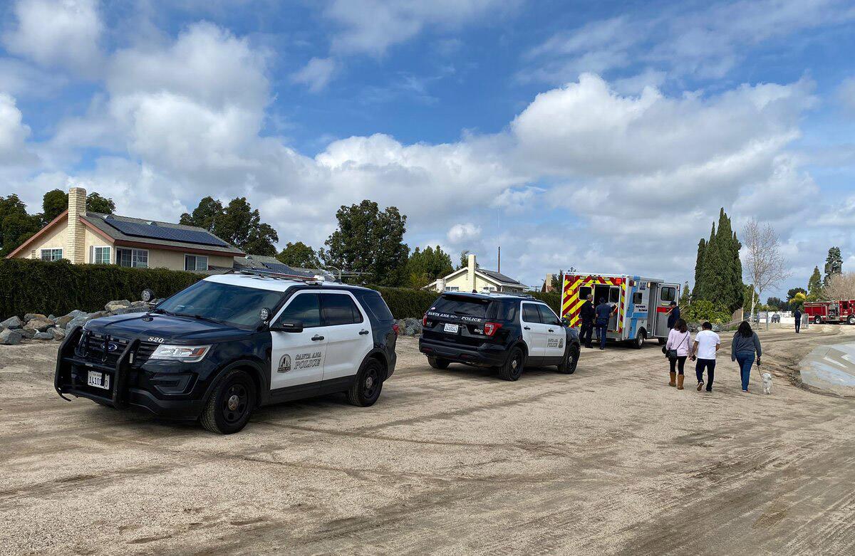 Emergency vehicle on the scene after a boy was swept away by fast moving waters in the Santa Ana River.