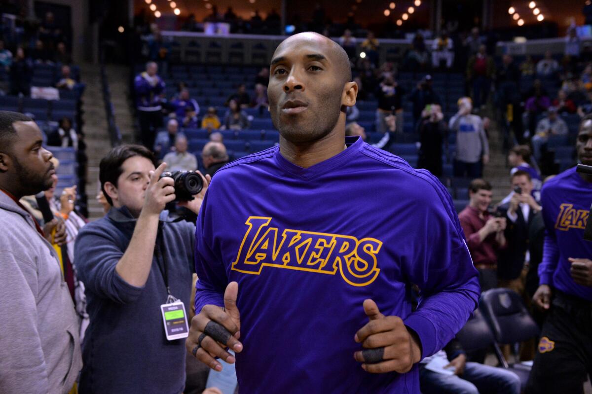 Lakers forward Kobe Bryant runs on to the court before a game against the Grizzlies on Feb. 24.