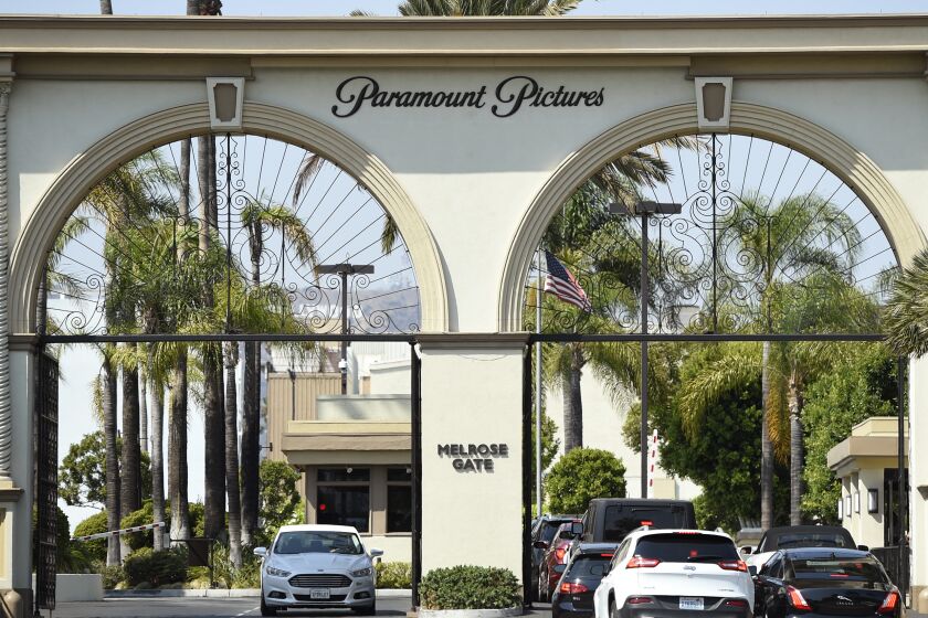 FILE - The Paramount Pictures gate is pictured on Aug. 23, 2016, in Los Angeles. The studio is joining other major Hollywood studios in slashing the traditional 90-day theatrical window. ViacomCBS on Wednesday, Feb. 24, 2021, announced that the studio's films, including "Mission: Impossible 7" and "A Quiet Place Part II," will go to its fledgling streaming service, Paramount+, after 45 days in theaters. (Photo by Chris Pizzello/Invision/AP, File)