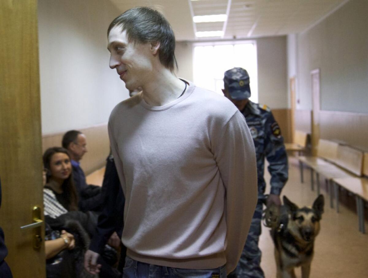 Pavel Dmitrichenko, shown being escorted to a court room in Moscow on Tuesday, was sentenced to six years for his role in the January acid attack on the Bolshoi's artistic director.