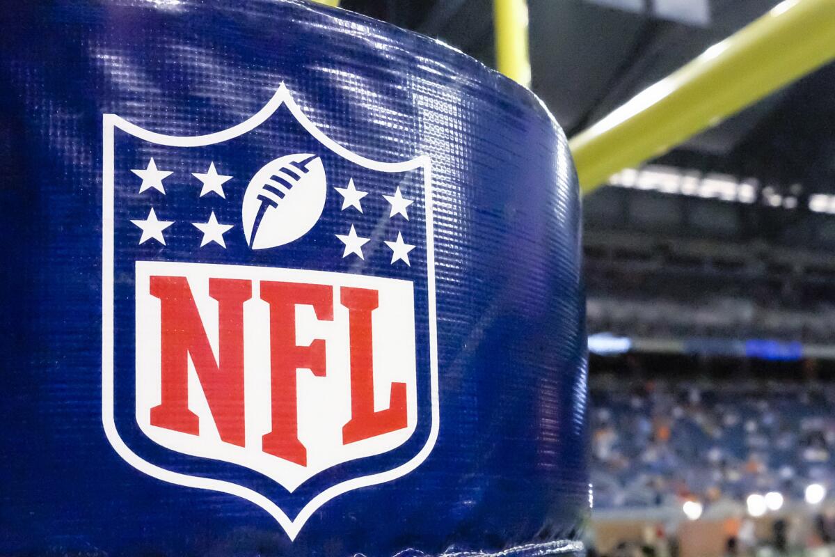 An NFL logo is seen on goalpost padding at a preseason game between the Detroit Lions and the Cleveland Browns in Detroit on Aug. 9, 2014.