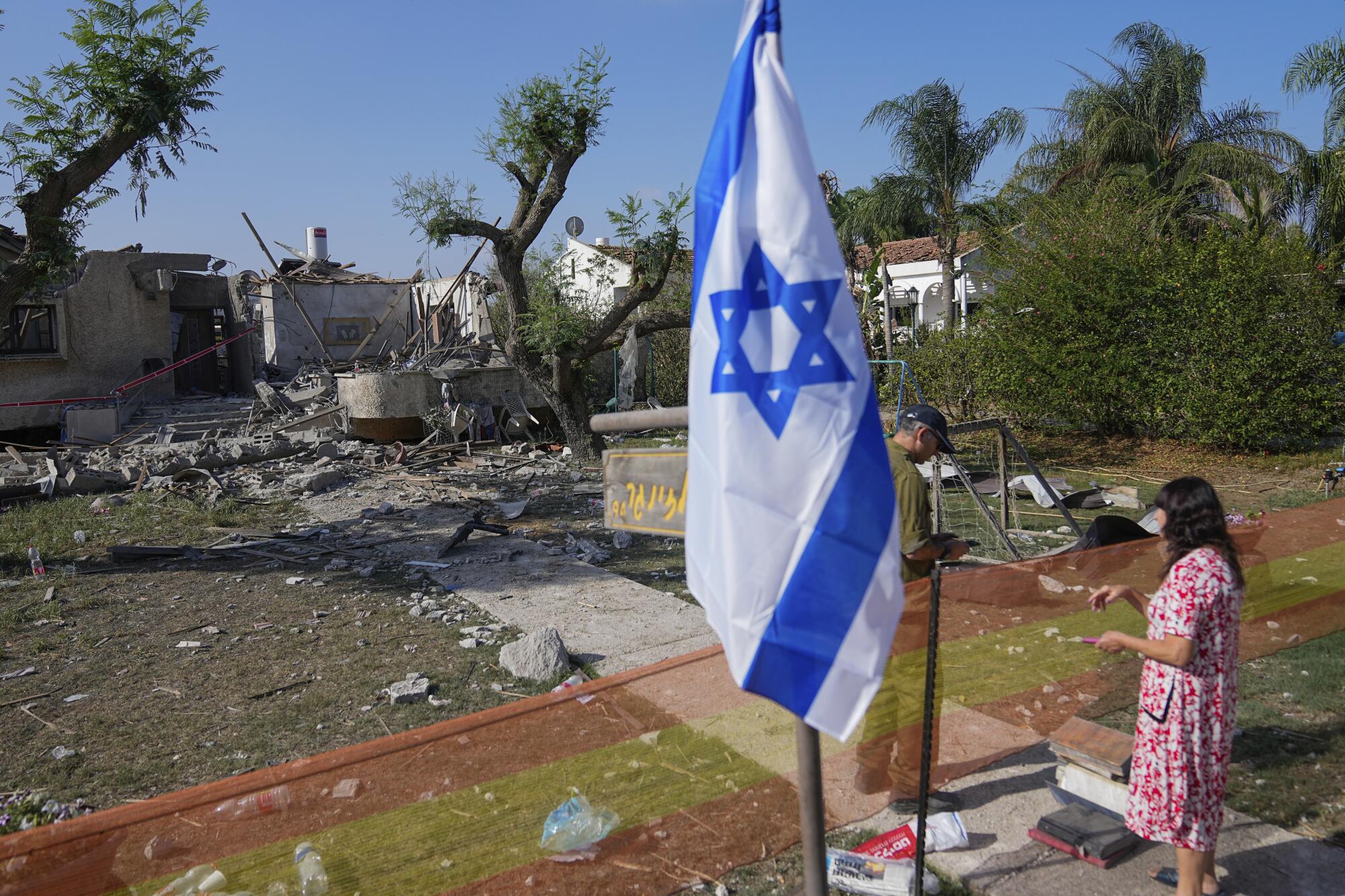 Israeli flag planted near house damaged by rocket fire from Gaza