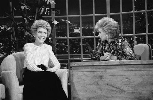 FILE - In this Oct. 30, 1986 file photo, talk show host Joan Rivers, right, talks with guest, first lady Nancy Reagan, during her appearance on "The Late Show Starring Joan Rivers," on Fox TV. The role of female talk-show hosts in late-night TV network history, all 50-plus years of it, can be summed up in two words: Joan Rivers. It takes just another two _ Arsenio Hall _ to do the same for minorities. There's no indication that's going to change in the latest round of musical chairs involving "T