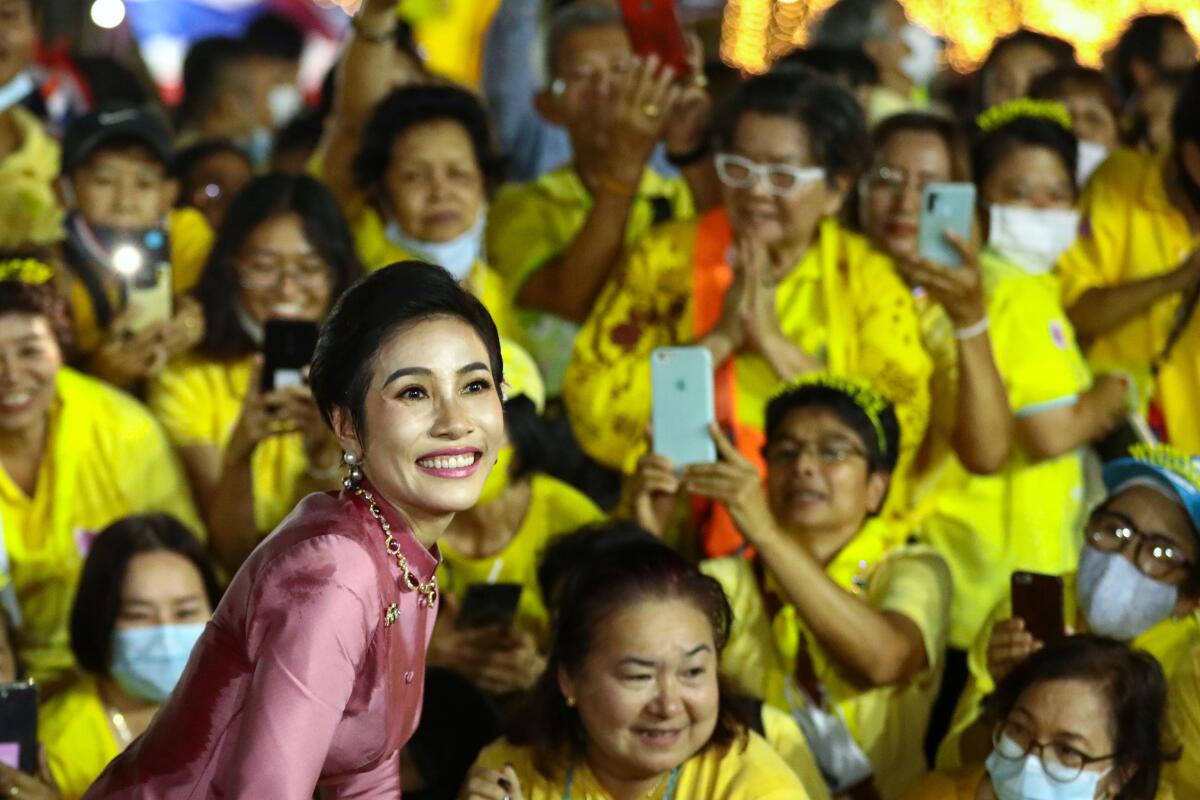 Thailand's royal noble consort, Sineenat Bilaskalayani, greets supporters Nov. 1 outside Bangkok's Grand Palace.