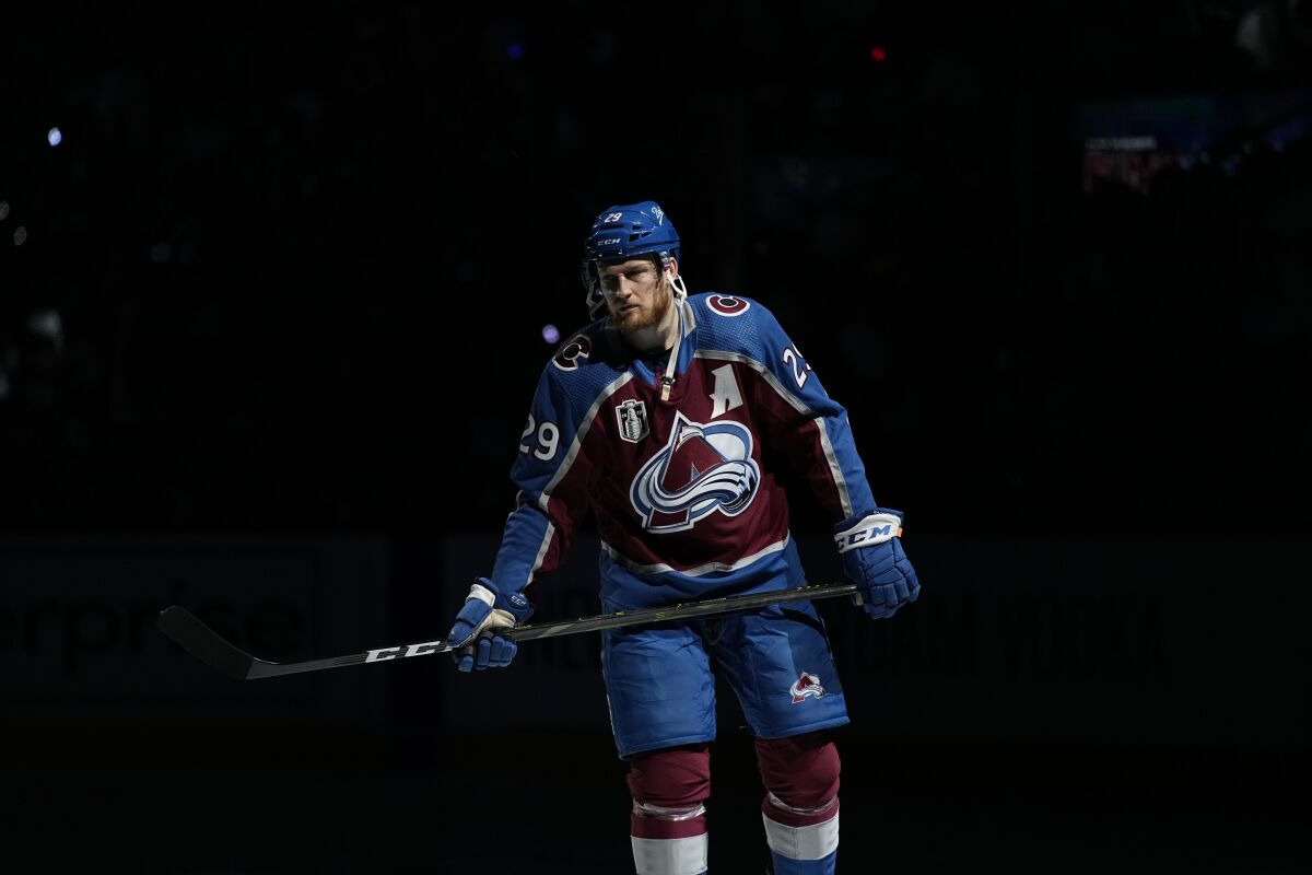 Colorado Avalanche center Nathan MacKinnon (29) warms up for Game 1 of the team's NHL hockey Stanley Cup Final against the Tampa Bay Lightning on Wednesday, June 15, 2022, in Denver. (AP Photo/John Locher)