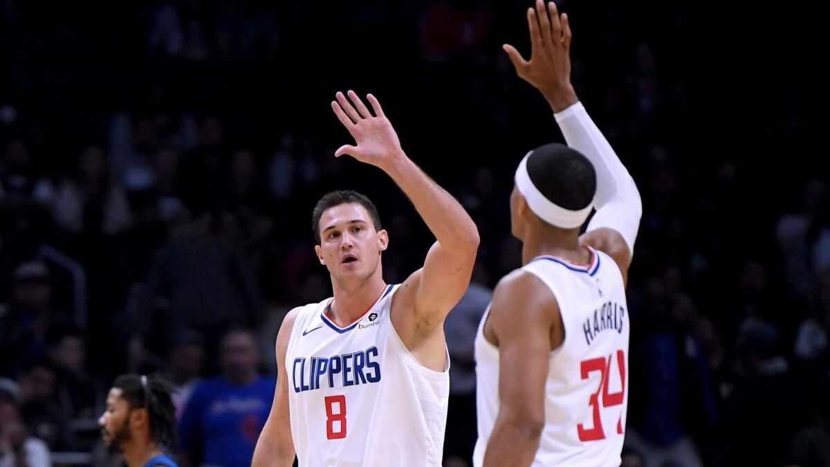 Clippers forwards Danilo Gallinari (8) and Tobias Harris combined to make six of 13 shots from three-point range during a 120-109 victory over Minnesota on Monday night.