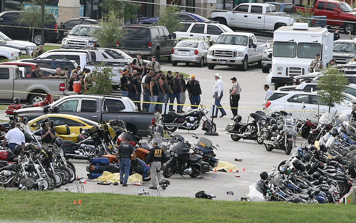 In this May 17 photo, authorities investigate a shooting in the parking lot of the Twin Peaks restaurant, in Waco, Texas. Nine people were killed and 20 injured.