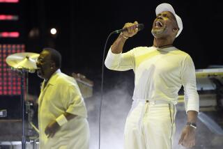 FILE - Maze featuring Frankie Beverly, right, performs during the Essence Music Festival at the Louisiana Superdome in New Orleans, Sunday, July 5, 2009. (AP Photo/Patrick Semansky, File)