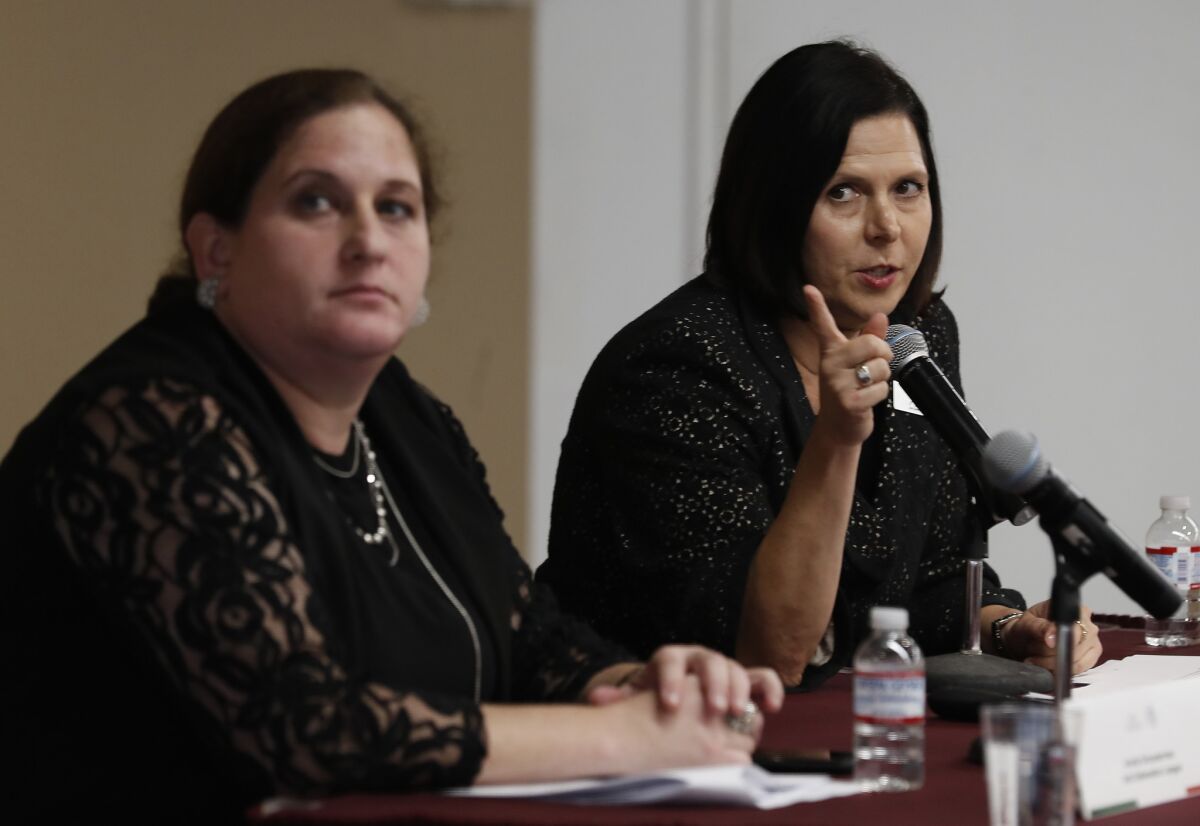 Ariella Schusterman, left, and Monica Bauer of the Anti-Defamation League speak during a workshop on responding to hate crimes at L.A.'s Mexican Consulate.