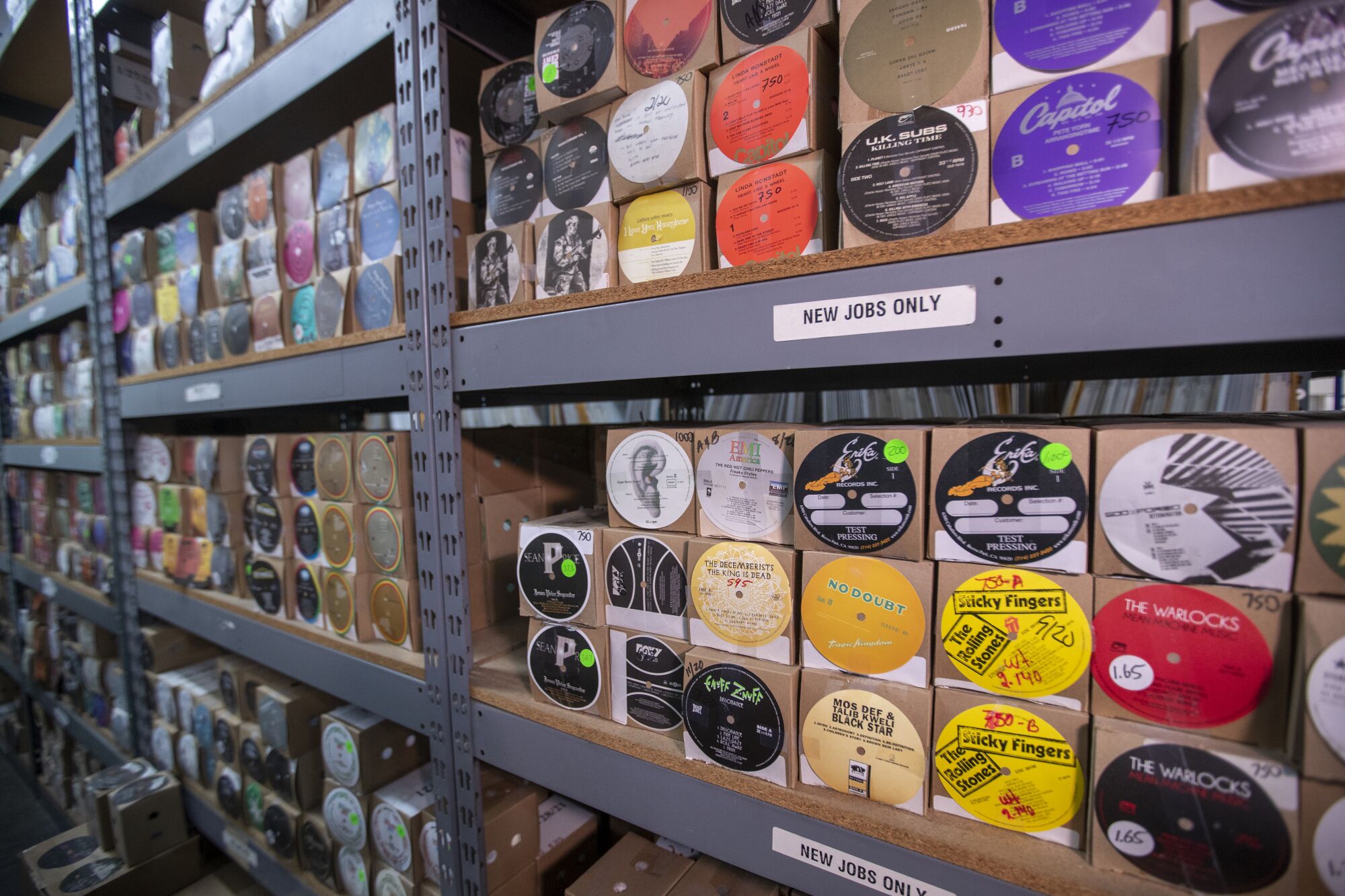 Boxes of center labels for the middle of records line shelves in the full-capacity plant.