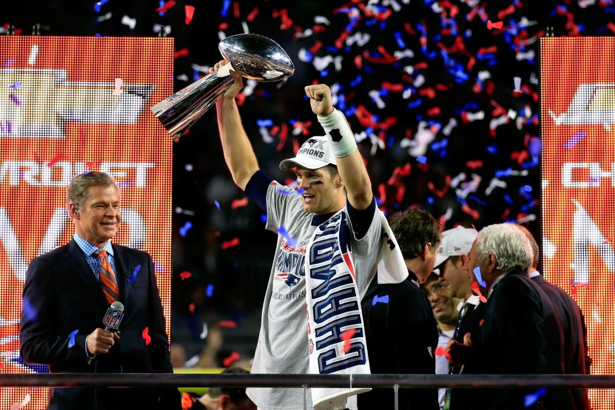 Patriots quarterback Tom Brady holds aloft the Vince Lombardi Trophy during the awards presentation following a 28-24 victory over the Seahawks in Super Bowl XLIX. The Patriots will begin defending their title on Sept. 10 against the Pittsburgh Steelers.