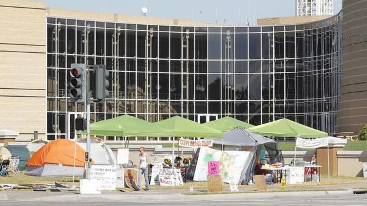 Irvine City Council voted to allow Occupy demonstrators to sleep on the Civic Center lawn. Now the council is considering repealing the city's living wage law.