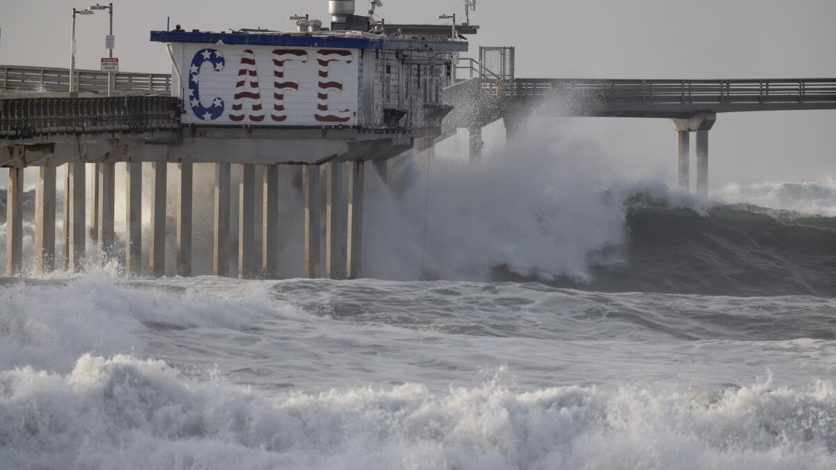 Closed Ocean Beach Pier is further damaged by high surf - Point