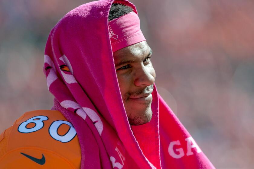 Broncos tight end Julius Thomas shades his head before the start of a game against the Cardinals on Sunday in Denver.