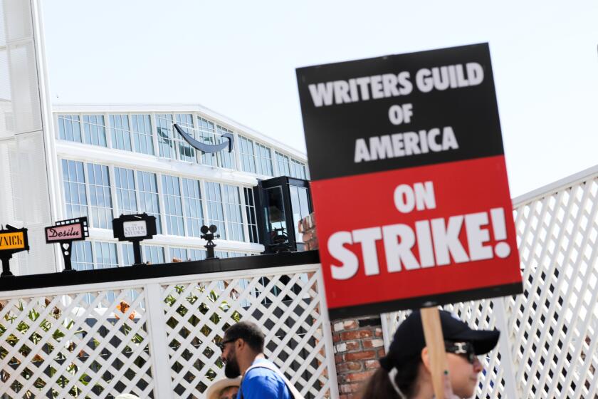 Culver City, CA - May 02: Writers Guild of America members walk the picket line on the first day of their strike in front of Amazon studios on Tuesday, May 2, 2023, in Culver City, CA. (Jay L. Clendenin / Los Angeles Times)