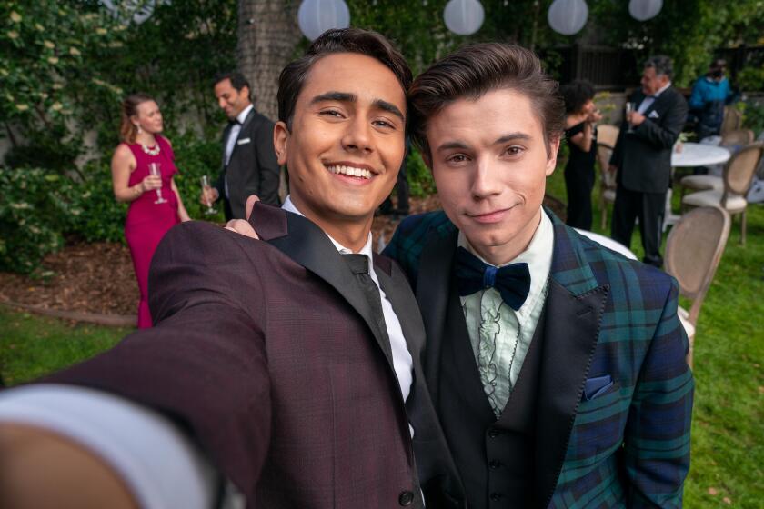 Michael Cimino (left, with costar Anthony Turpel), stars as Victor in Hulu's queer-themed coming-of-age show "Love, Victor."