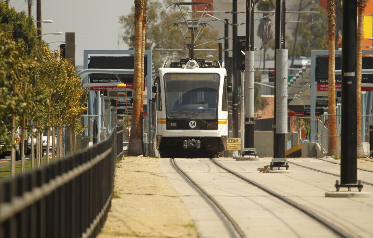 Metro staff test a train on the first phase of the Expo Line near Exposition Park and the USC campus.